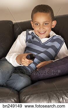 Stock Photograph - smiling boy watching 
television. fotosearch 
- search stock 
photos, pictures, 
images, and photo 
clipart