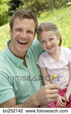 Stock Photo - father and daughter 
with dandelions. 
fotosearch - search 
stock photos, 
pictures, images, 
and photo clipart
