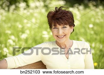 Stock Photo - outdoor portrait 
of woman. fotosearch 
- search stock 
photos, pictures, 
images, and photo 
clipart