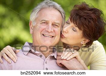 Stock Photo - woman kissing 
man. fotosearch 
- search stock 
photos, pictures, 
images, and photo 
clipart