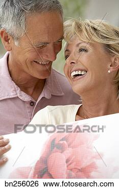 Stock Photo - woman with man 
smiling. fotosearch 
- search stock 
photos, pictures, 
images, and photo 
clipart