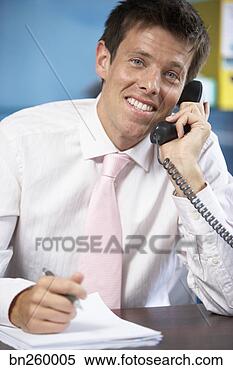 Stock Image - man talking on 
telephone. fotosearch 
- search stock 
photos, pictures, 
images, and photo 
clipart