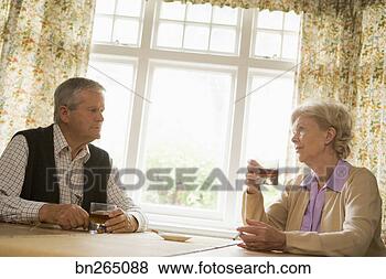 Stock Photo - couple drinking 
and smoking at 
home. fotosearch 
- search stock 
photos, pictures, 
images, and photo 
clipart
