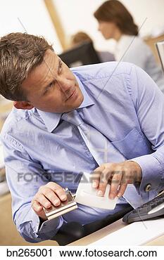 Stock Photography - man pouring alcohol 
into coffee. fotosearch 
- search stock 
photos, pictures, 
images, and photo 
clipart
