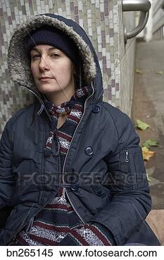Stock Image - woman sitting 
against wall. 
fotosearch - search 
stock photos, 
pictures, images, 
and photo clipart