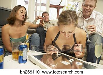Stock Photography - woman using drugs 
at party. fotosearch 
- search stock 
photos, pictures, 
images, and photo 
clipart