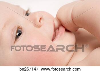 Picture - smiling baby sucking 
thumb. fotosearch 
- search stock 
photos, pictures, 
images, and photo 
clipart