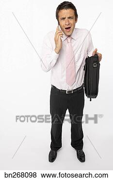 Stock Photo - businessman on 
cell phone. fotosearch 
- search stock 
photos, pictures, 
images, and photo 
clipart