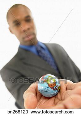 Stock Photography - businessman holding 
miniature globe. 
fotosearch - search 
stock photos, 
pictures, images, 
and photo clipart