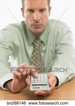 Stock Photo - man with calculator. 
fotosearch - search 
stock photos, 
pictures, images, 
and photo clipart