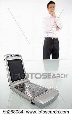 Stock Photo - man and cell phone. 
fotosearch - search 
stock photos, 
pictures, images, 
and photo clipart