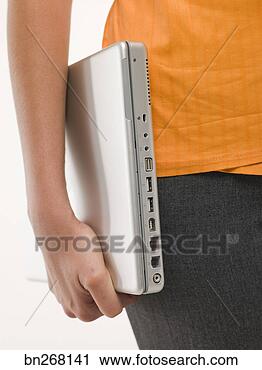 Stock Photography - person holding 
laptop under arm. 
fotosearch - search 
stock photos, 
pictures, images, 
and photo clipart