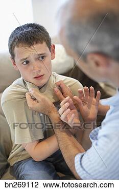 Stock Photo - father assaulting 
son. fotosearch 
- search stock 
photos, pictures, 
images, and photo 
clipart