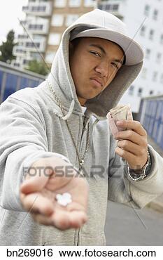 Stock Photo - teenage boy with 
drugs and money. 
fotosearch - search 
stock photos, 
pictures, wall 
murals, images, 
and photo clipart