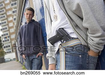 Stock Image - teenage boys with 
gun. fotosearch 
- search stock 
photos, pictures, 
images, and photo 
clipart