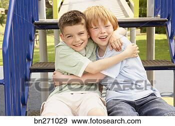 Stock Photograph - boys hugging. 
fotosearch - search 
stock photos, 
pictures, images, 
and photo clipart