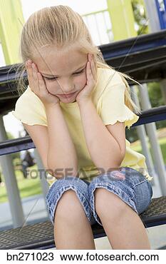 Stock Photo - girl that is looking 
sad. fotosearch 
- search stock 
photos, pictures, 
images, and photo 
clipart