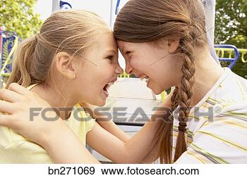 Stock Photograph - girls face to 
face. fotosearch 
- search stock 
photos, pictures, 
images, and photo 
clipart