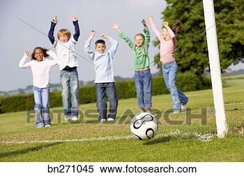 Stock Image - kids cheering 
and playing soccer. 
fotosearch - search 
stock photos, 
pictures, images, 
and photo clipart