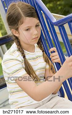 Picture - sad girl outdoors. 
fotosearch - search 
stock photos, 
pictures, images, 
and photo clipart