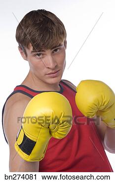 Stock Photography - boy with boxing 
gloves on. fotosearch 
- search stock 
photos, pictures, 
images, and photo 
clipart