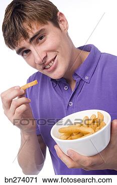 Stock Photography - boy eating french 
fries. fotosearch 
- search stock 
photos, pictures, 
images, and photo 
clipart