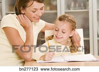 Stock Photo - mother helping 
daughter with 
homework. fotosearch 
- search stock 
photos, pictures, 
images, and photo 
clipart