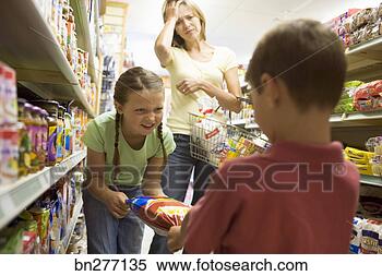 Stock Image - mother with mischievous 
children at grocery 
store. fotosearch 
- search stock 
photos, pictures, 
images, and photo 
clipart
