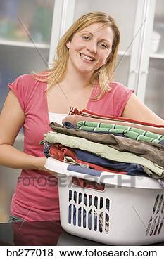 Stock Photo - woman with basket 
of laundry. fotosearch 
- search stock 
photos, pictures, 
images, and photo 
clipart