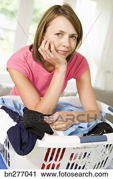 Stock Photography - woman with basket 
of laundry. fotosearch 
- search stock 
photos, pictures, 
images, and photo 
clipart