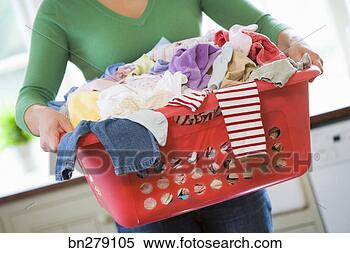 Stock Image - woman carrying 
laundry basket. 
fotosearch - search 
stock photos, 
pictures, images, 
and photo clipart