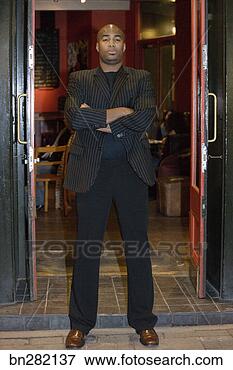 Picture - bouncer standing 
in doorway. fotosearch 
- search stock 
photos, pictures, 
images, and photo 
clipart