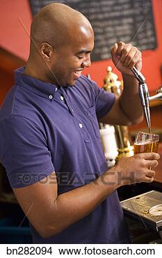 Stock Photo - man pouring beer 
from tap. fotosearch 
- search stock 
photos, pictures, 
images, and photo 
clipart