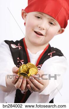 Stock Photo - boy in pirate 
costume with gold 
coins. fotosearch 
- search stock 
photos, pictures, 
images, and photo 
clipart