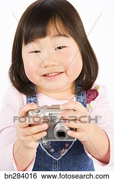 Stock Photo - girl with camera. 
fotosearch - search 
stock photos, 
pictures, images, 
and photo clipart