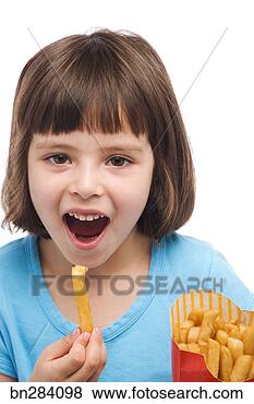 Stock Photo - girl eating fries. 
fotosearch - search 
stock photos, 
pictures, images, 
and photo clipart