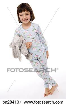 Picture - girl in pajamas 
with stuffed animal. 
fotosearch - search 
stock photos, 
pictures, images, 
and photo clipart