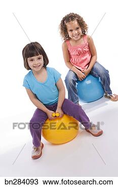 Stock Photo - girls bouncing 
on balls. fotosearch 
- search stock 
photos, pictures, 
images, and photo 
clipart