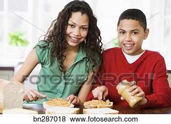 Stock Photo - boy and girl smearing 
peanut butter 
on bread. fotosearch 
- search stock 
photos, pictures, 
images, and photo 
clipart