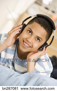 Stock Photography - boy with headphones. 
fotosearch - search 
stock photos, 
pictures, images, 
and photo clipart