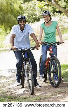 Stock Photo - couple on bicycles. 
fotosearch - search 
stock photos, 
pictures, images, 
and photo clipart