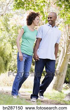 Stock Photography - couple walking 
together. fotosearch 
- search stock 
photos, pictures, 
images, and photo 
clipart