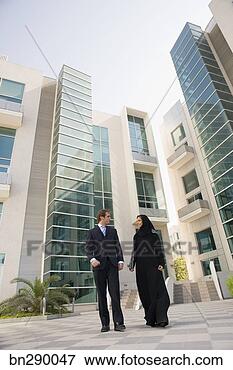 Picture - businesspeople 
walking outdoors. 
fotosearch - search 
stock photos, 
pictures, images, 
and photo clipart