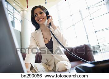 Stock Photo - smiling businesswoman 
on phone. fotosearch 
- search stock 
photos, pictures, 
images, and photo 
clipart