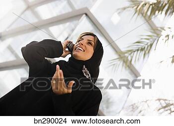 Stock Photo - woman on cell 
phone. fotosearch 
- search stock 
photos, pictures, 
images, and photo 
clipart