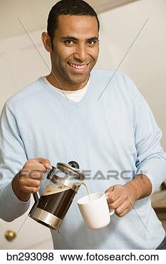Stock Photo - man pouring french 
press coffee into 
mug. fotosearch 
- search stock 
photos, pictures, 
images, and photo 
clipart