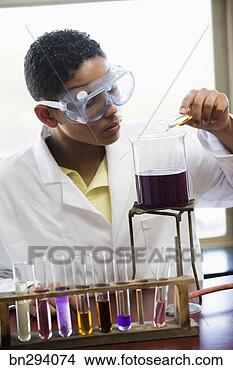 Stock Photo - student doing 
science experiment 
in class. fotosearch 
- search stock 
photos, pictures, 
images, and photo 
clipart