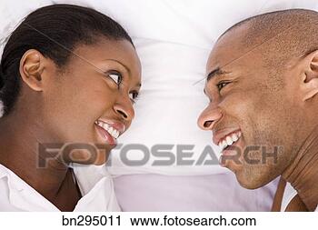 Stock Photography - couple face to 
face in bed. fotosearch 
- search stock 
photos, pictures, 
images, and photo 
clipart