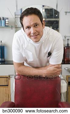 Stock Photography - barber leaning 
on chair. fotosearch 
- search stock 
photos, pictures, 
images, and photo 
clipart