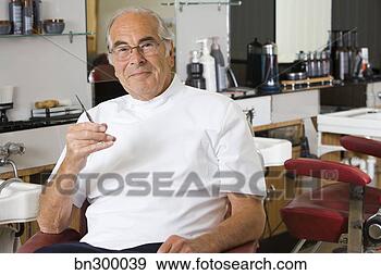 Stock Photograph - barber sitting 
in chair. fotosearch 
- search stock 
photos, pictures, 
images, and photo 
clipart